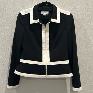 Calvin Klein black and white jacket. Gold zipper front and lined lined size 6.